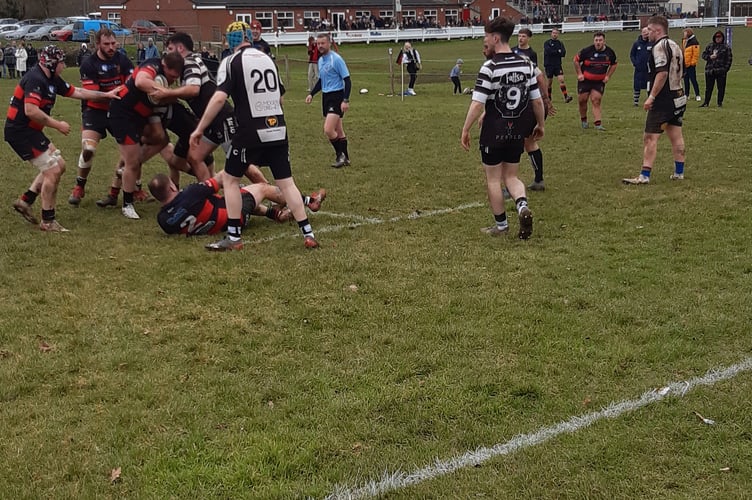 Jack Dyer powers towards the Wells try line.