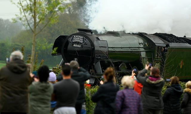 WELLINGTON, ENGLAND - APRIL 30: The Flying Scotsman makes their way past crowds of people as it embarks on a tour of the West Country from Bristol to Cornwall. The special trip is part of a series of 2023 mainline steam tour dates planned by the National Railway Museum for the Flying Scotsmanâs centenary celebrations on April 30, 2023 in Wellington, England. (Photo by Harry Trump/Getty Images)