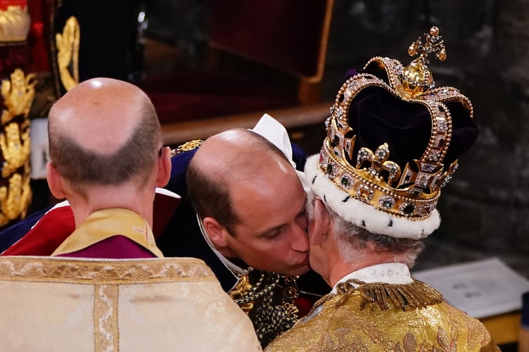 The Prince of Wales kisses his father King Charles III during his coronation ceremony in Westminster Abbey, London. Picture date: Saturday May 6, 2023. PA Photo. See PA story ROYAL Coronation. Photo credit should read: Yui Mok/PA Wire