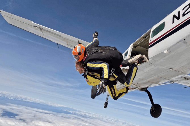 Mollie James takes her jump over Dunkeswell with parachute pilot Neil Empringham.