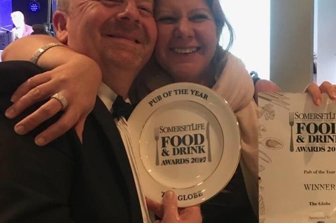 Mark and Adele Tarry celebrating a food and drink award for The Globe.