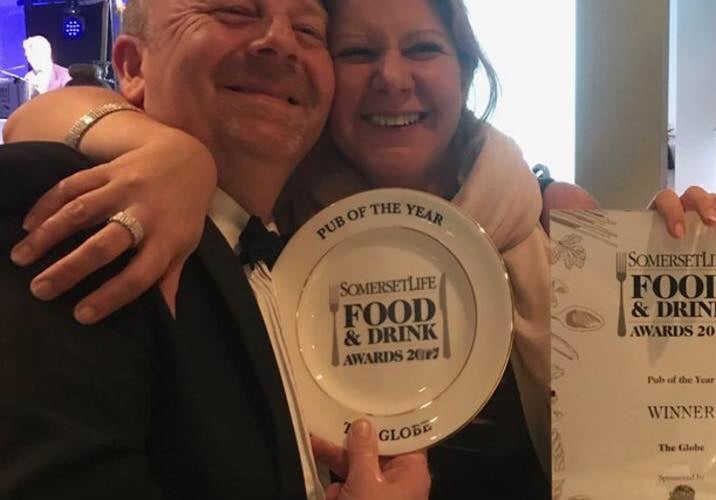 Mark and Adele Tarry celebrating a food and drink award for The Globe.