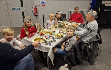 A Christmas meal being enjoyed in Wellington Baptist Church warm place.