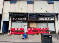 'Pedestrian near miss' after window falls from former newsagents 