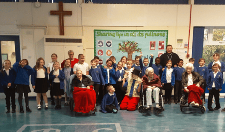 Archie meets Rockwell Green primary School pupils and some elderly residents.