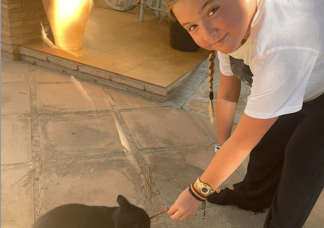 Harper Pumfrey with her family cat.