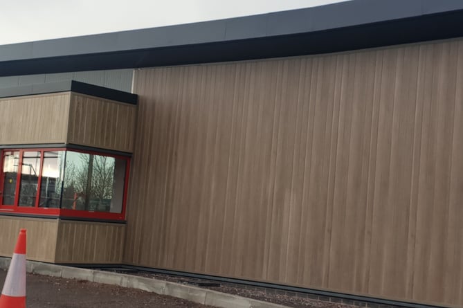 A drive-thru kiosk window can be seen in this photograph of the under-construction Wellington KFC restaurant.