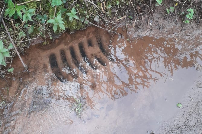 A drain already overwhelmed by water in Payton Road, Westford, Rockwell Green, this week.