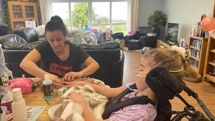 Harper Pumfrey at home with her mother Heidi.