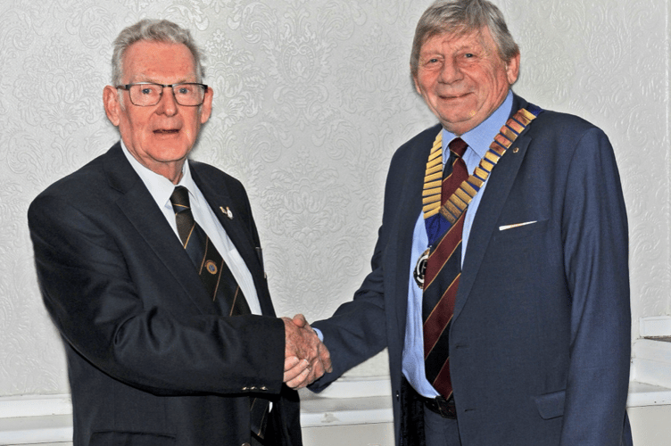 Mike Dillan congratulating John Burton on becoming president of the club