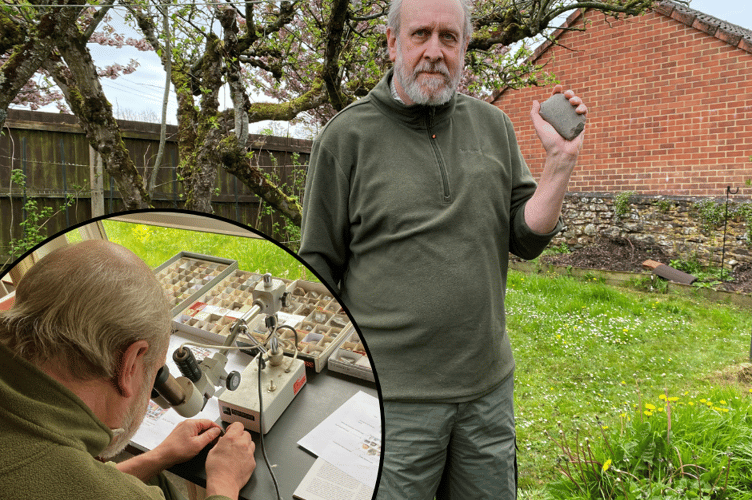 Dr Andrew Berkley, pictured with a stone axe head he believes dates back to the Bronze Age which was discovered in a Wellington field