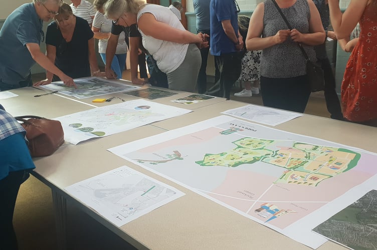 Maps and drawings were on show at a Persimmon Homes public consultation on proposed new housing in Popes Lane, Rockwell Green.