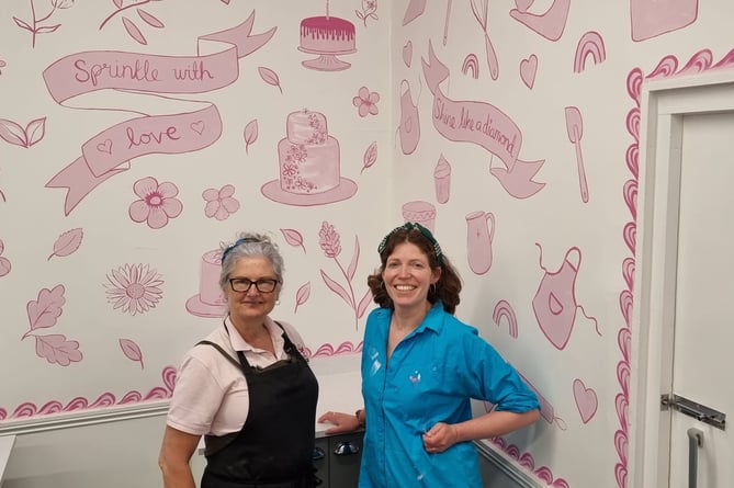 A House of Cake's Lesley Retallack (left) with Wellington artist Alex Williams and the new mural.