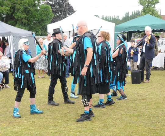 The Enigma morris dancers entertained at the fete and flower show