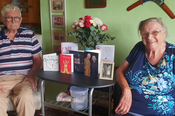 William and Rosemary Franks, known as Bill and June, with cards received for their 70th wedding anniversary, including from the King and Queen.