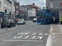 Bus trapped on railings freed after almost five hours