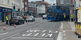 Bus trapped on railings freed after almost five hours