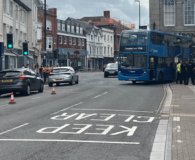 Bus trapped on railings freed after almost five hours