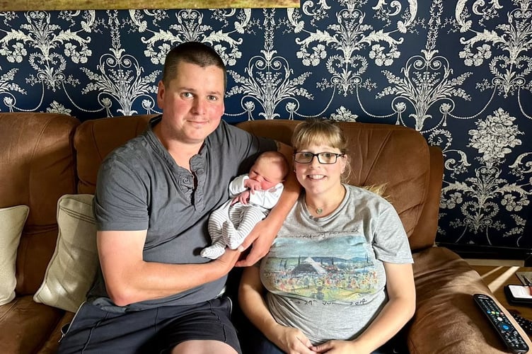 Duncan and Cat Bennett with Baby Amelia. Photo released August 12 2024. A couple got the shock of their lives when they were forced to deliver their own baby - in a moving Land Rover. Cat Bennett, 35, was two days past her due date when she started having contractions. Her labour only lasted two hours - and she gave birth on the way to the hospital.Thinking she was feeling for dilation, husband Duncan Bennett, 39, was gobsmacked when Cat pulled baby Amelia, nine days old, on the edge of Odbridge roundabout in Taunton.
