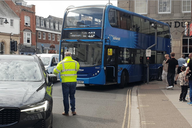 A double deck bus became stuck on railings in Wellington town centre.