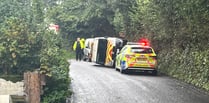 Police close road as van overturns near Wellington