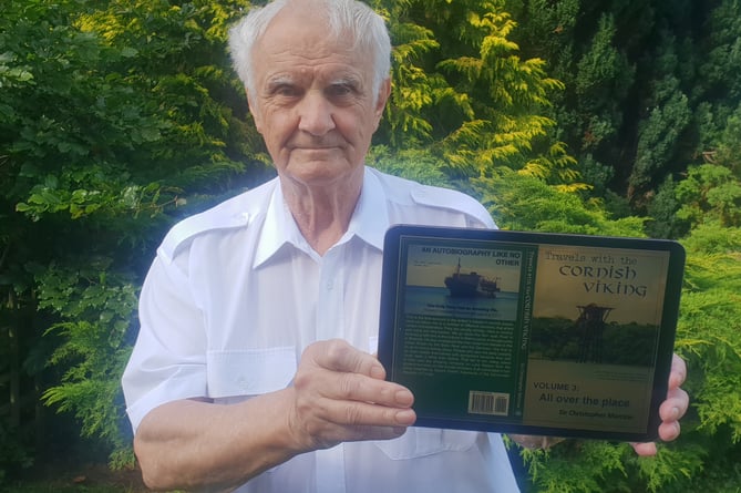 Wellington marine expert and environmentalist Chris Marrow with the cover of his latest book.