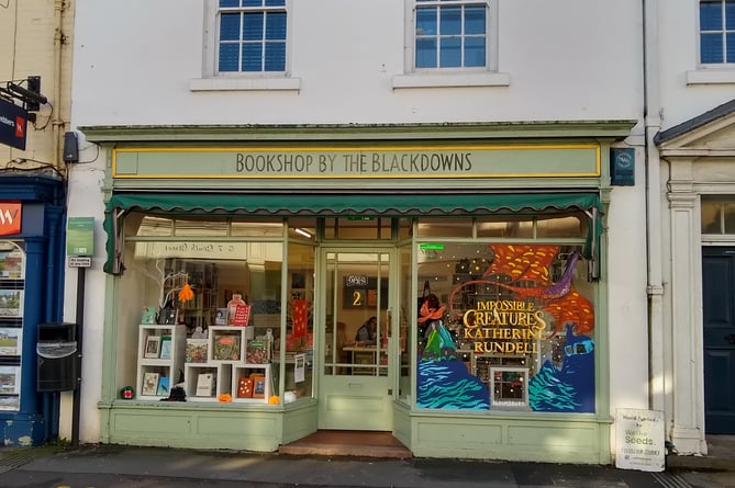 Blackdowns bookshop has won a prize draw sponsored by Bloomsbury to have its window hand painted by creative arts agency We the Seeds.