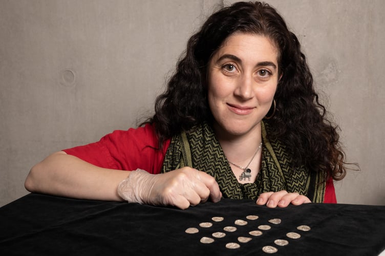 Curator of archaeology Amal Khreisheh with coins of the Chew Valley Hoard