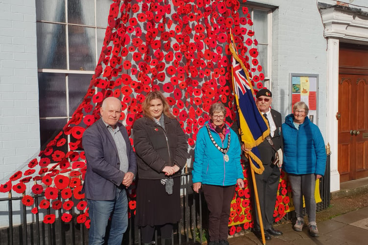 Wellington Mayor Cllr Janet Lloyd (centre) attends the unveiling of the town's poppies displays by Women's Institute members with (left to right) town Cllrs John Thorne and Catherine Govier, Royal British Legion standard bearer, Bob Trickey, and display organiser Bridget Hodges.