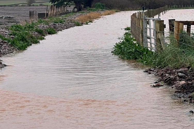 The Steam Coast Path in Dunster experienced severe flooding during Storm Bert