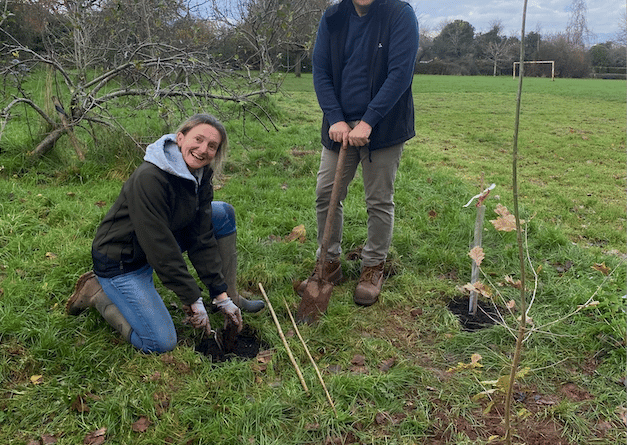 Wellington Town Council facilities manager Annette Kirk and open spaces manager Darren Hill planting trees in one of the town's green spaces. PHOTO: WTC.