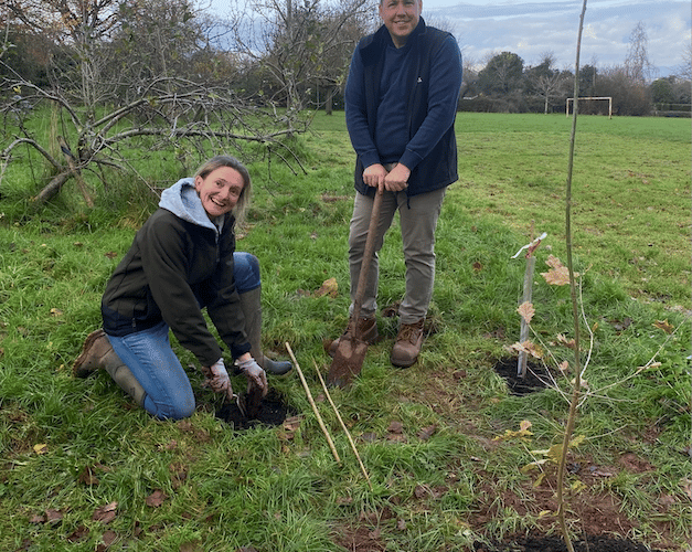 Wellington Town Council facilities manager Annette Kirk and open spaces manager Darren Hill planting trees in one of the town's green spaces. PHOTO: WTC.