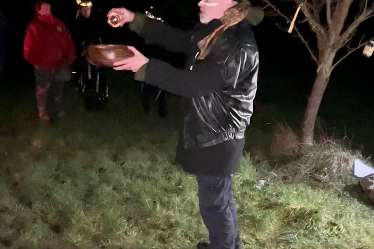 Mr Double Danger the 2nd holds the Wassail bowl